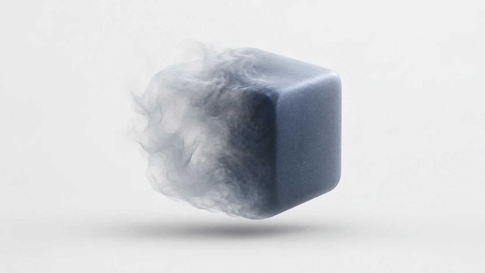 A soft, abstract form becoming a solid blue-grey cube, representing an idea taking shape.